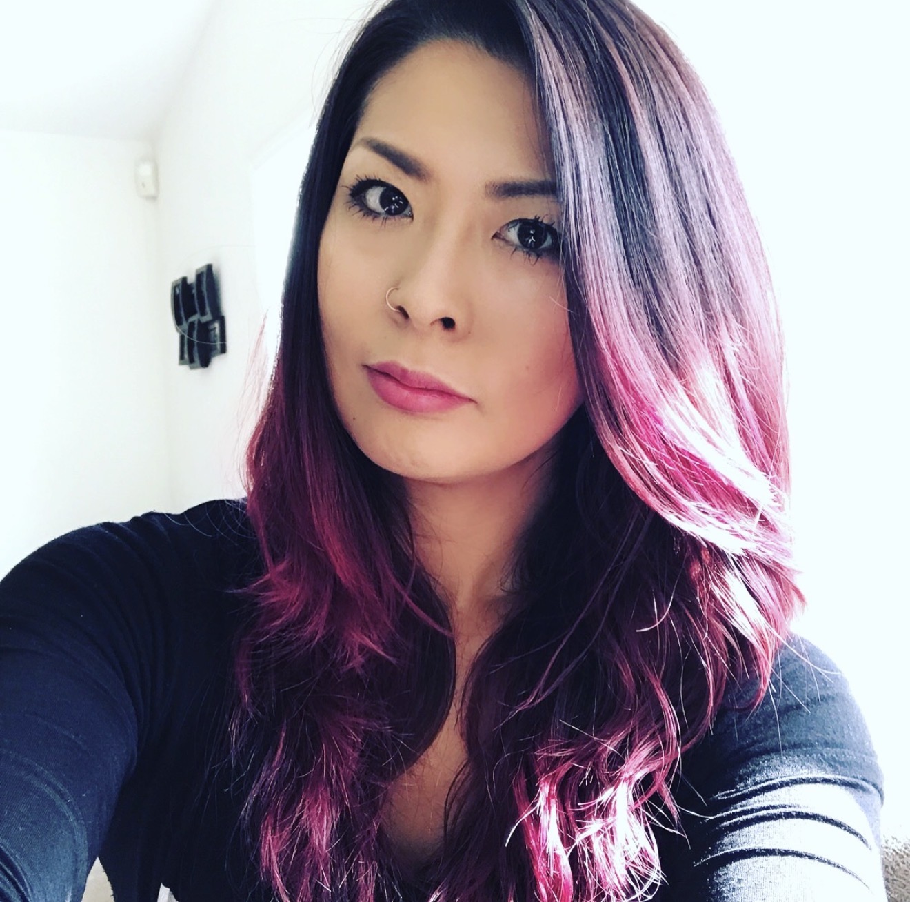 Ikumi with violet and pink hair, photographed in natural light